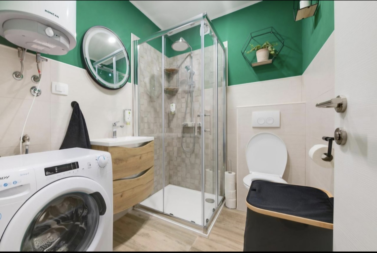Bathroom with shower and washing machine